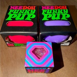 (2) pink/purple NeeDoh Funky Pup’s & (1) pink NeeDoh Groovy Jewel Squishy Set